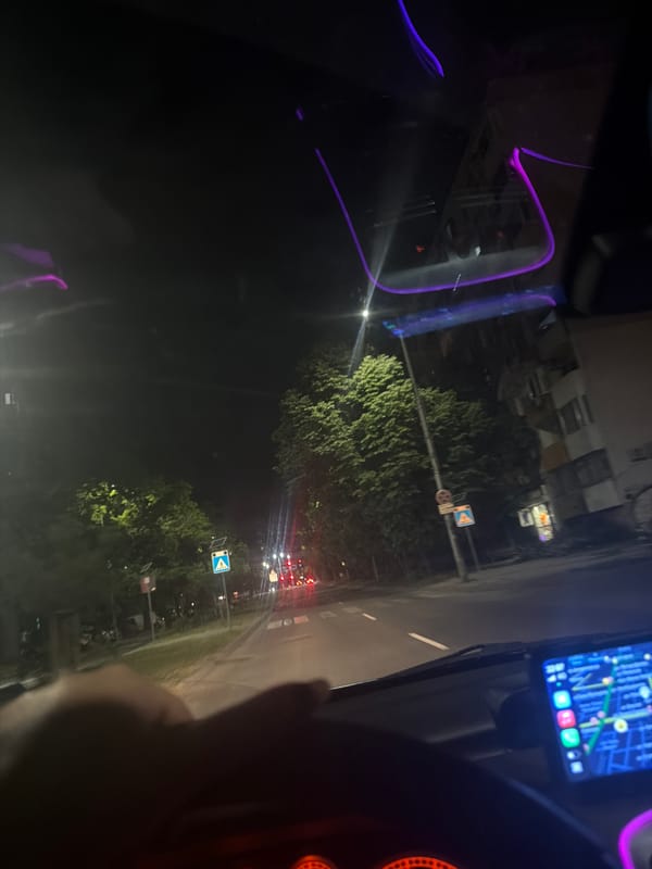 Driver navigates illuminated streets in Plovdiv using GPS system