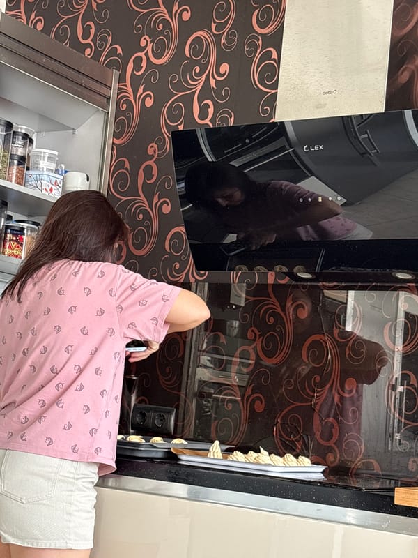 Woman uses smartphone in Saint Petersburg kitchen Tuesday morning
