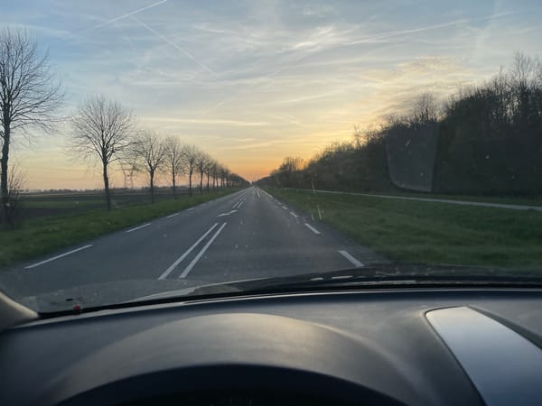 Motorist drives through Dronten on marked two-lane road