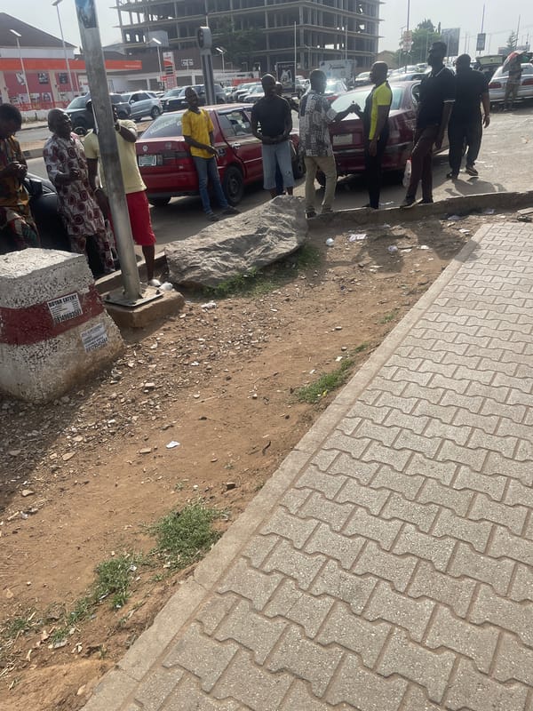 Busy street life captured in Abuja during afternoon hours