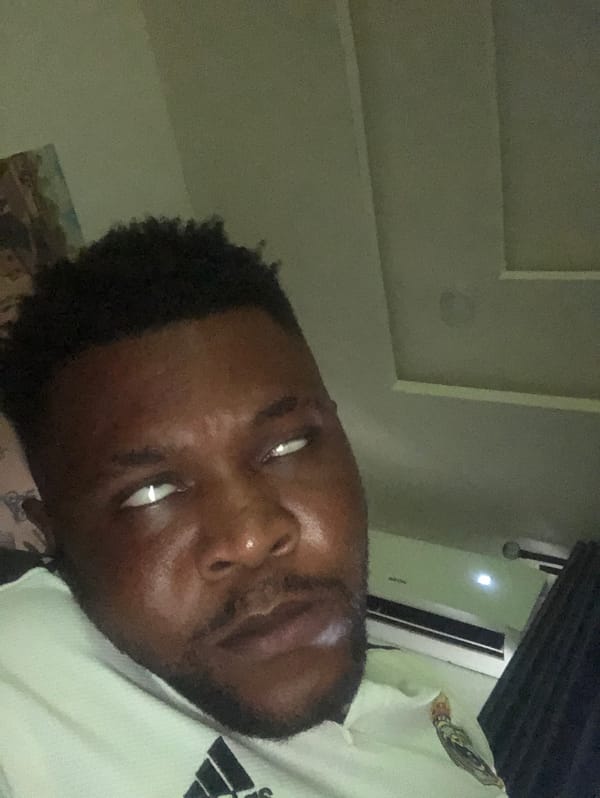 Man photographed repeatedly in outdoor selfie session near roadway