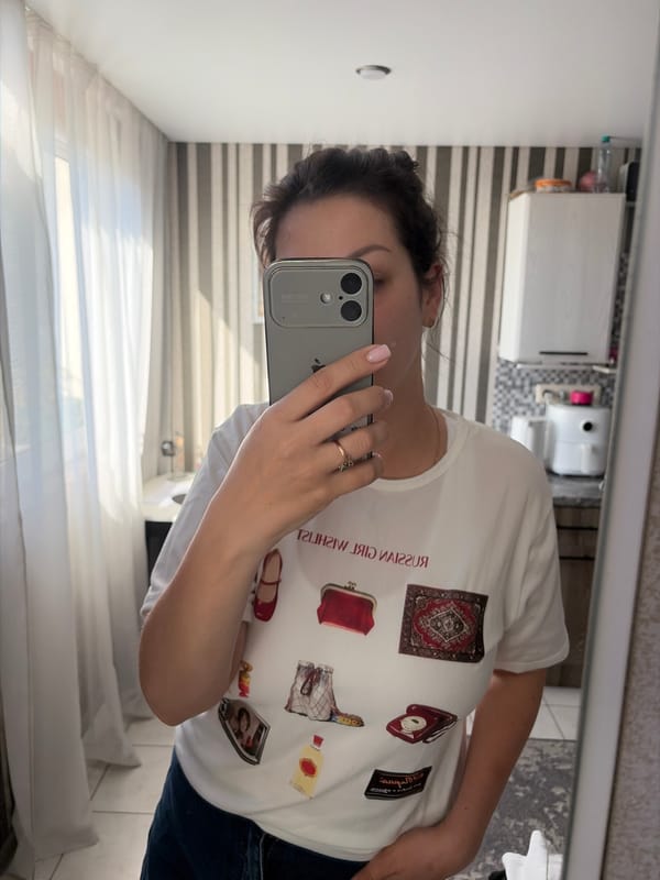 Woman takes selfie series in "Russian Girl Wishlist" shirt in Sochi