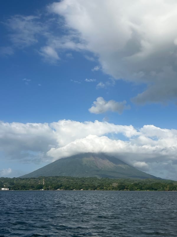 Cloud-draped volcano looms over Moyogalpa, Nicaragua