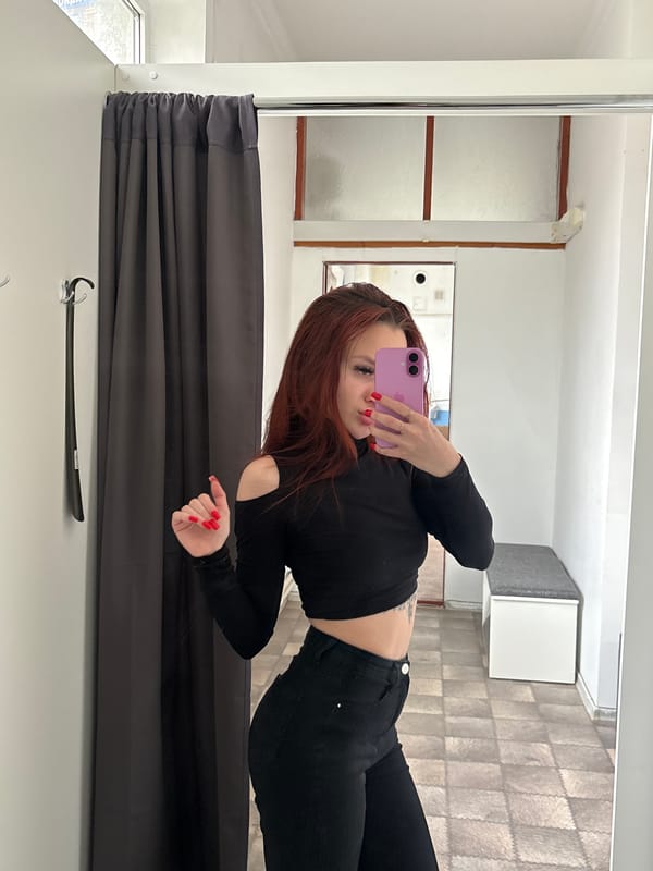 Woman takes mirror selfies in Simferopol fitting room