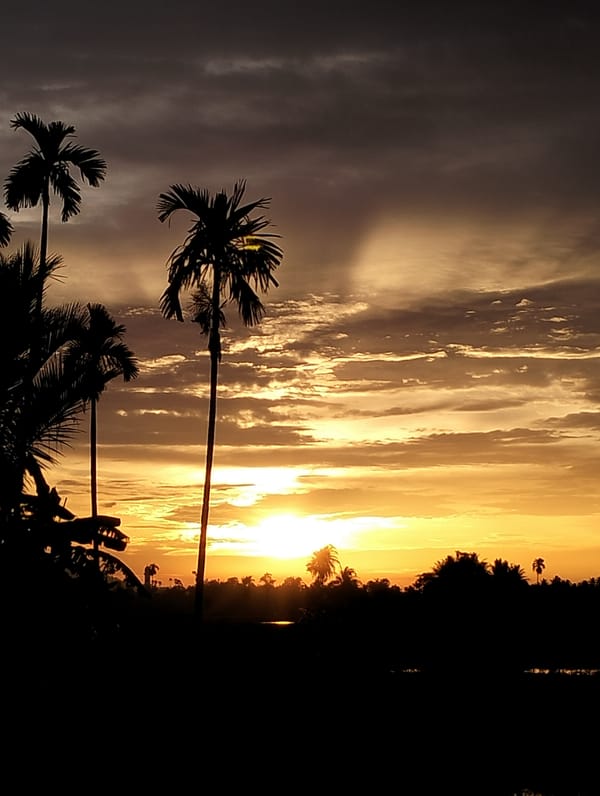 Sunrise skies and rural community life in Meunasahalue, Aceh