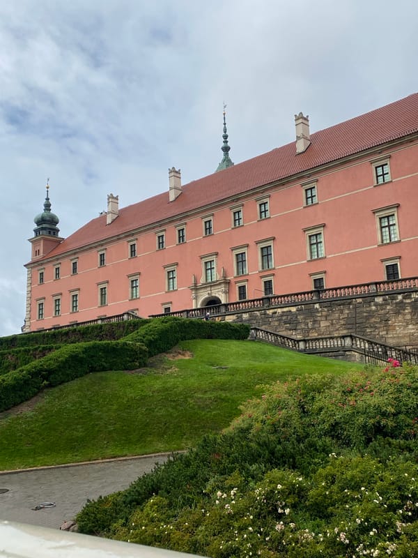 Exploring Warsaw's Royal Castle grounds on a grey afternoon