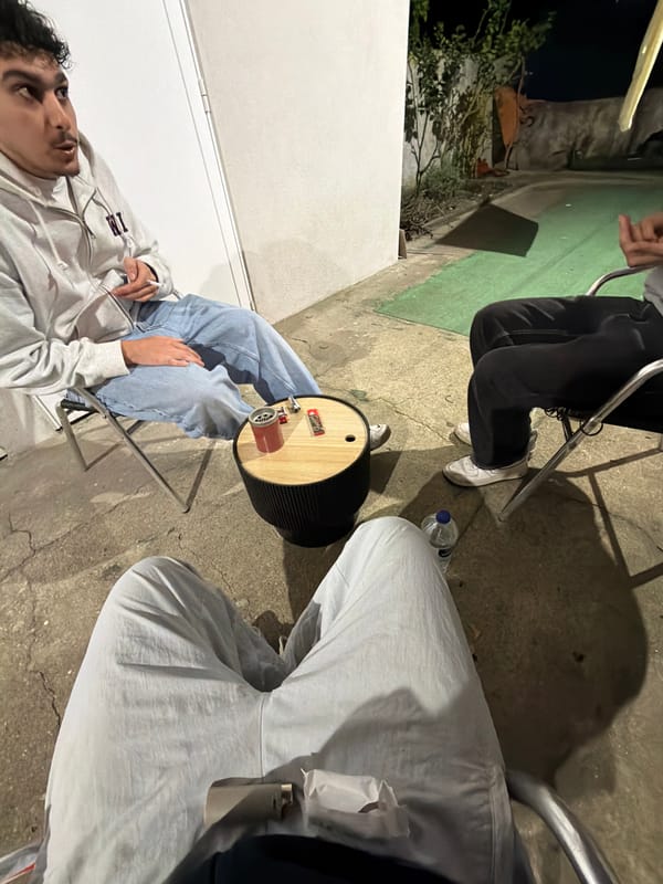 Nighttime outdoor gathering of three people in Vila Real