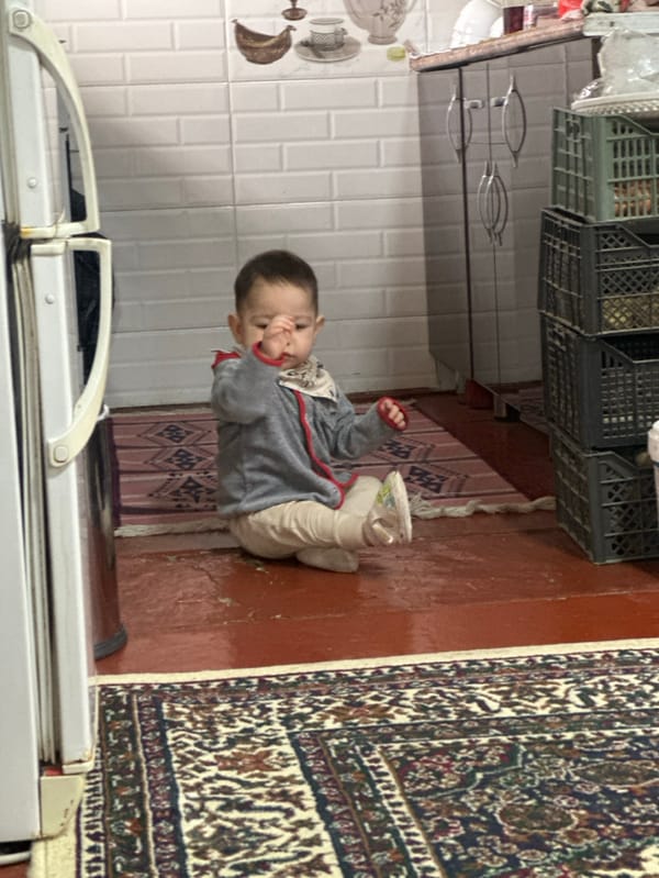 Father documents morning routine with baby in Uzbekistan home