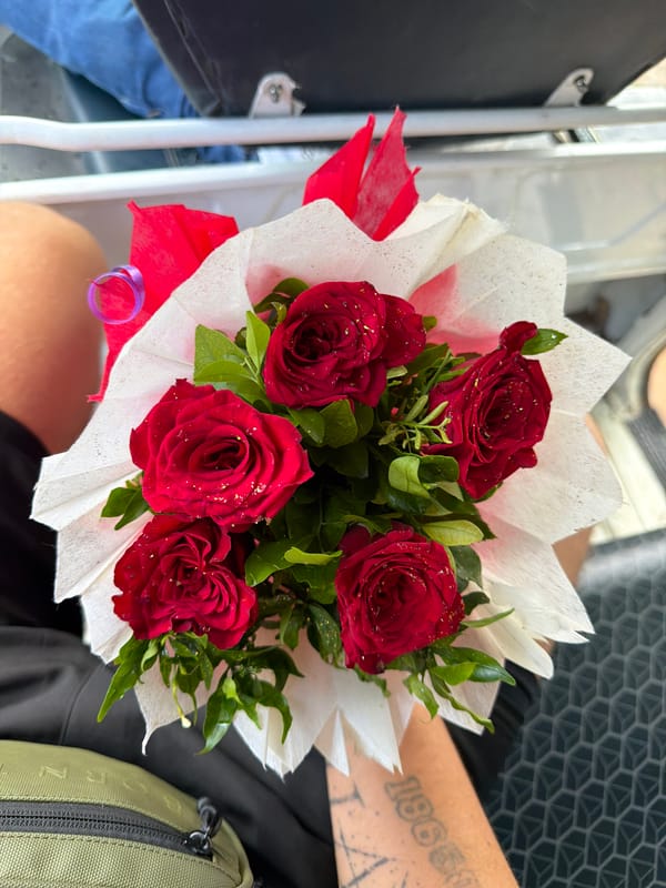 Red rose bouquet held up in Kanpur, July 2026