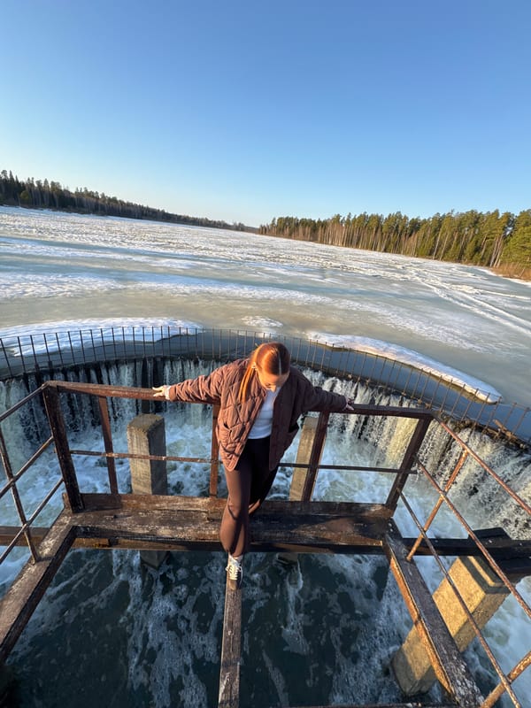 Person stands on metal platform over water in Rusalevka