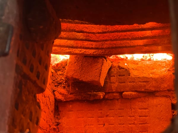 Brick structure interior with tiered steps documented in Zhigalki