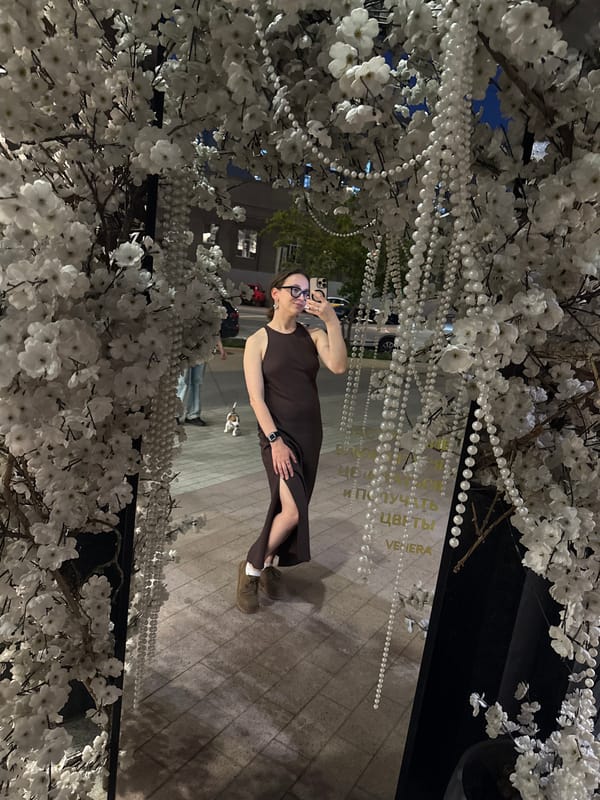 Woman photographed near decorated flower shop in Khimki, Russia