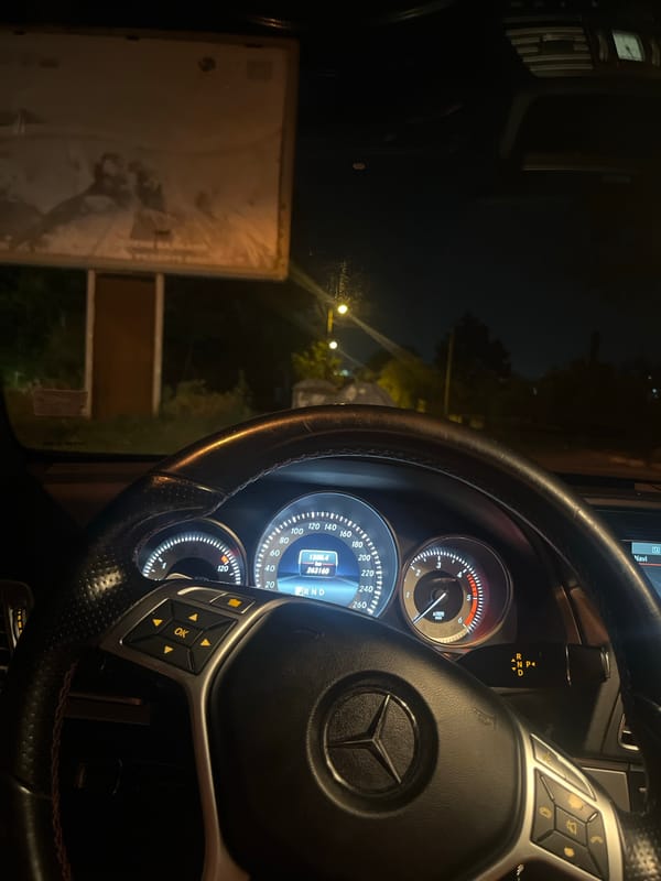 Mercedes-Benz spotted parked roadside at night with headlights on