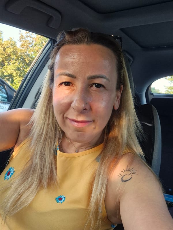 Selfie series from the driver's seat, sunny day.