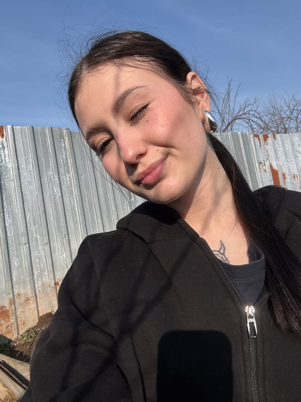 Woman and gray cat spotted in Foki, Russia yard