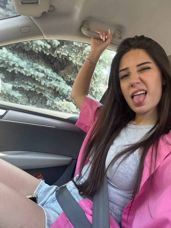Woman takes playful car selfies in Plovdiv Bulgaria