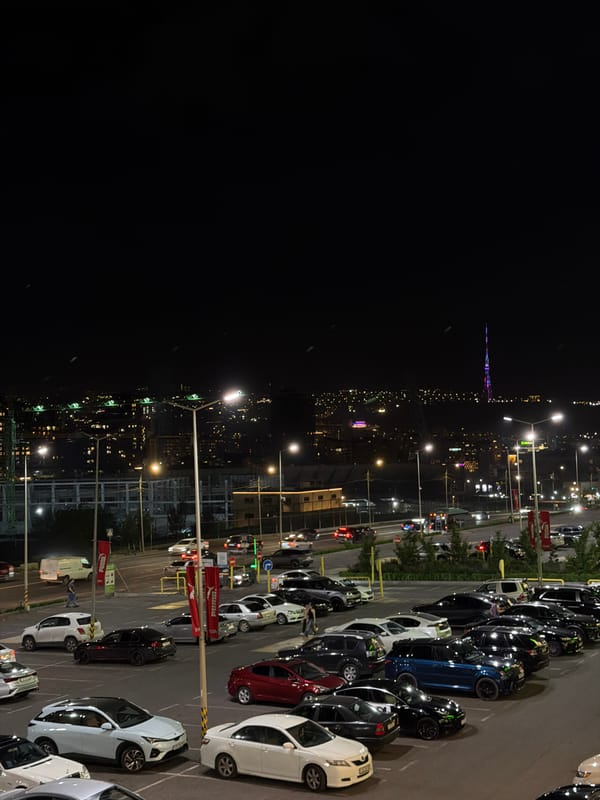 Evening scenes captured at Yerevan cafe and parking lot