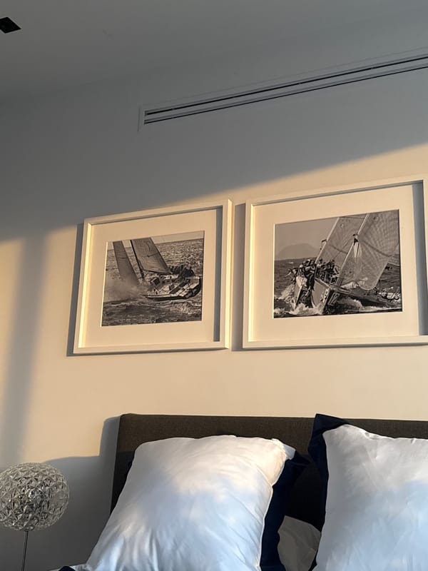 Mexico City bedroom displays sailboat artwork and lamp