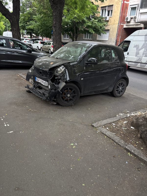 Damaged Smart car spotted on Zemun street following apparent collision