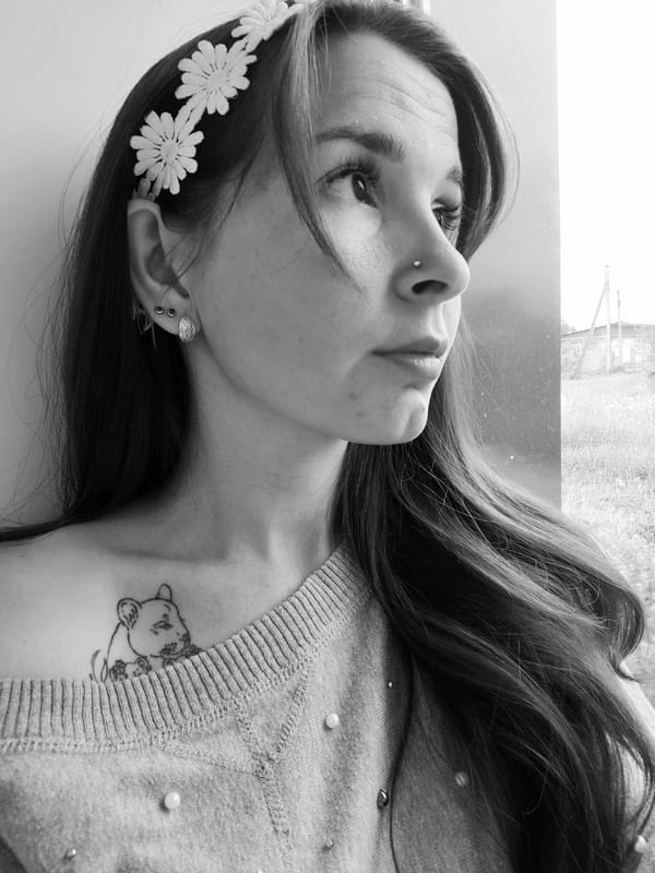 Woman with flower headband spotted at window in Фоки