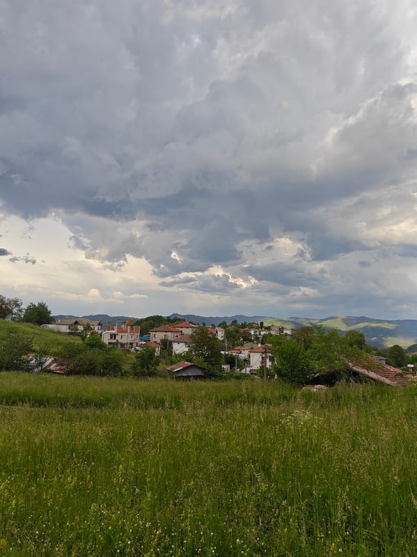 Rural field and houses observed in Maglishta, Bulgaria