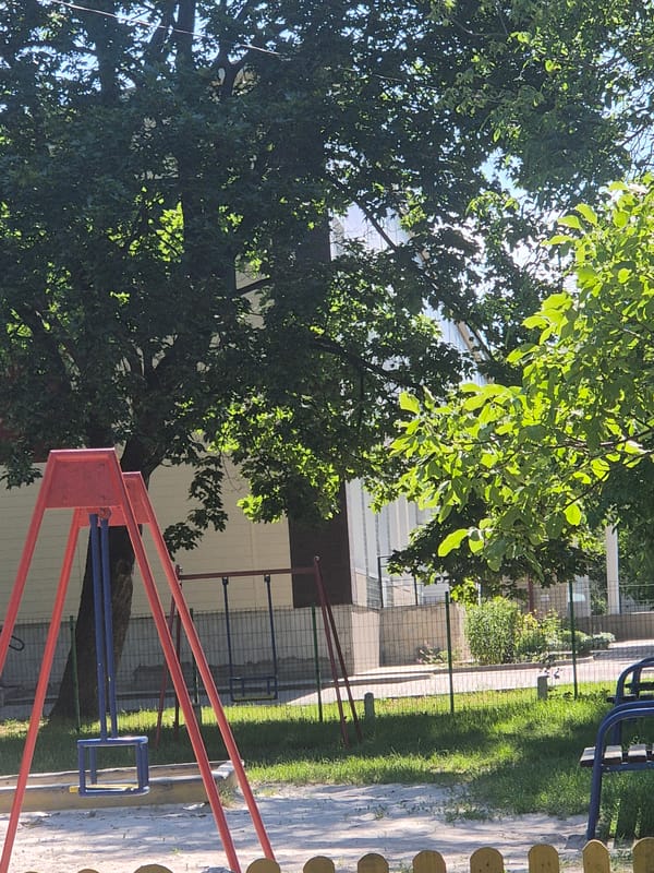 Quiet morning in a small Ukrainian village park and streets