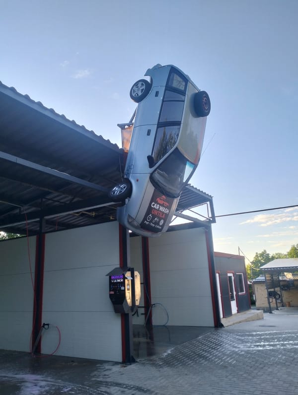 Upside-down car marks a quirky car wash in rural Moldova