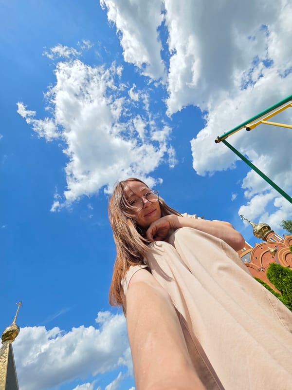 Sunny morning at a Chaikovsky park with playground and church views