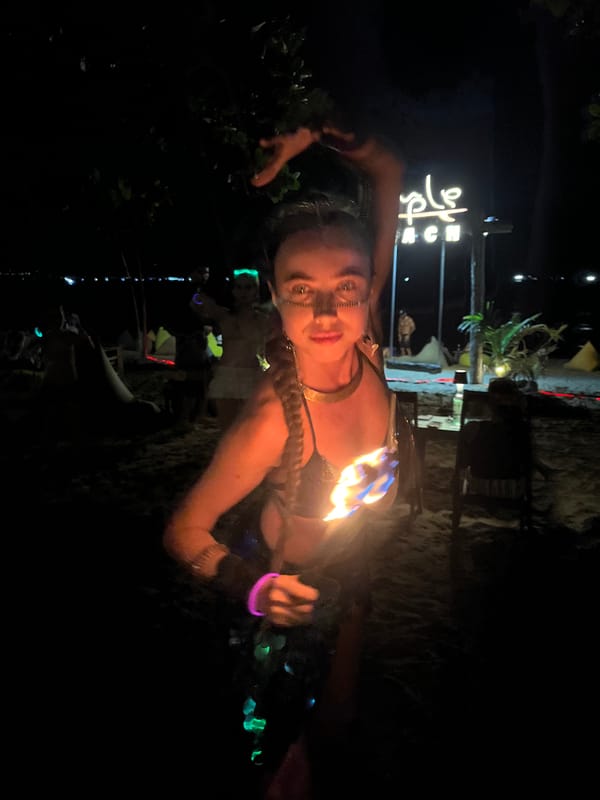 Fire dancers light up a Da Nang beach at night