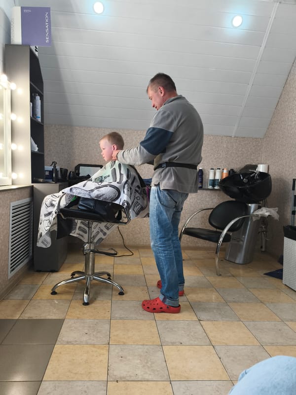 Routine indoor activities documented in Russian village salon