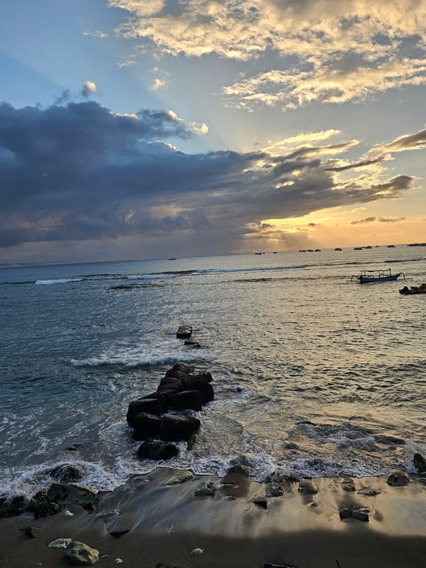 Sunset along the Denpasar waterfront, ferries and coastal views