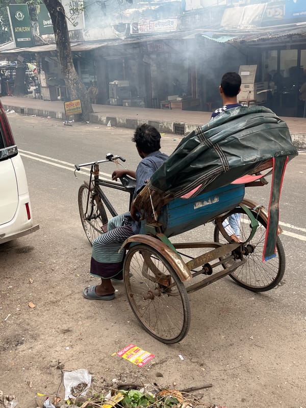 Rickshaw puller takes break in Dhaka