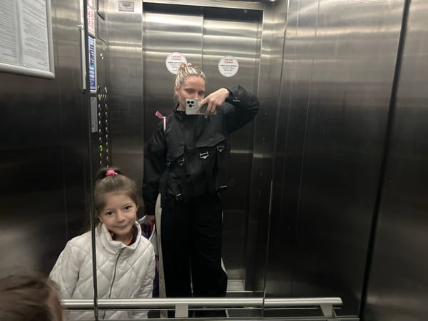 Woman and child navigate Istanbul streets with luggage