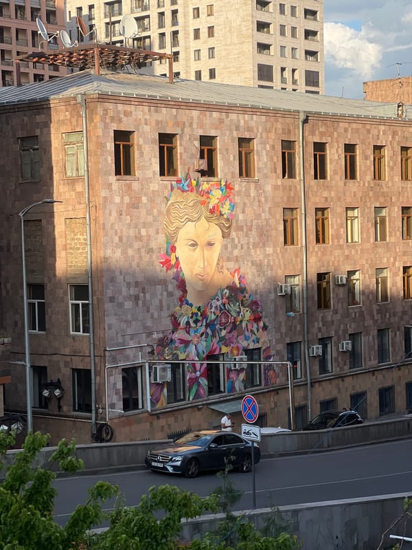 Street scenes captured in Yerevan featuring mural and parked cars