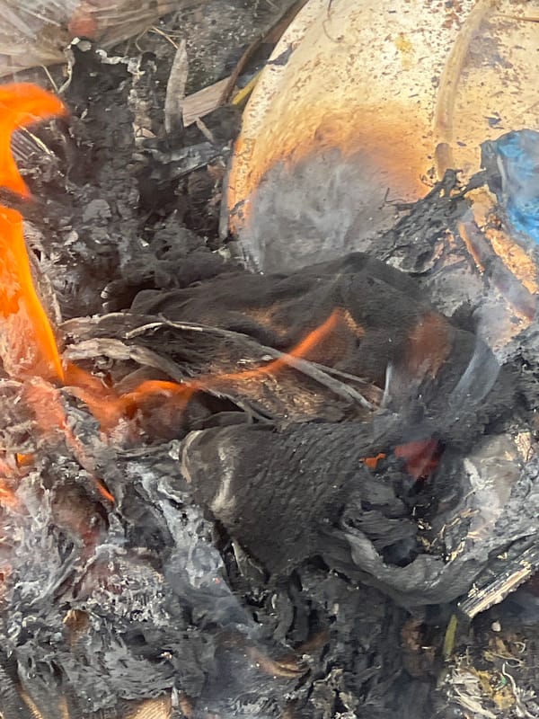 Trash fire burns in Gura Top, Nigeria
