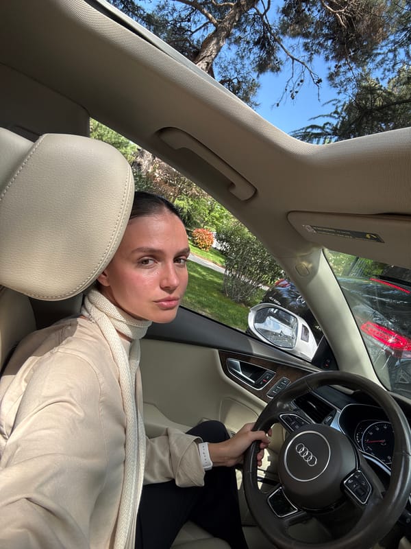 Woman rests in parked car in Tbilisi