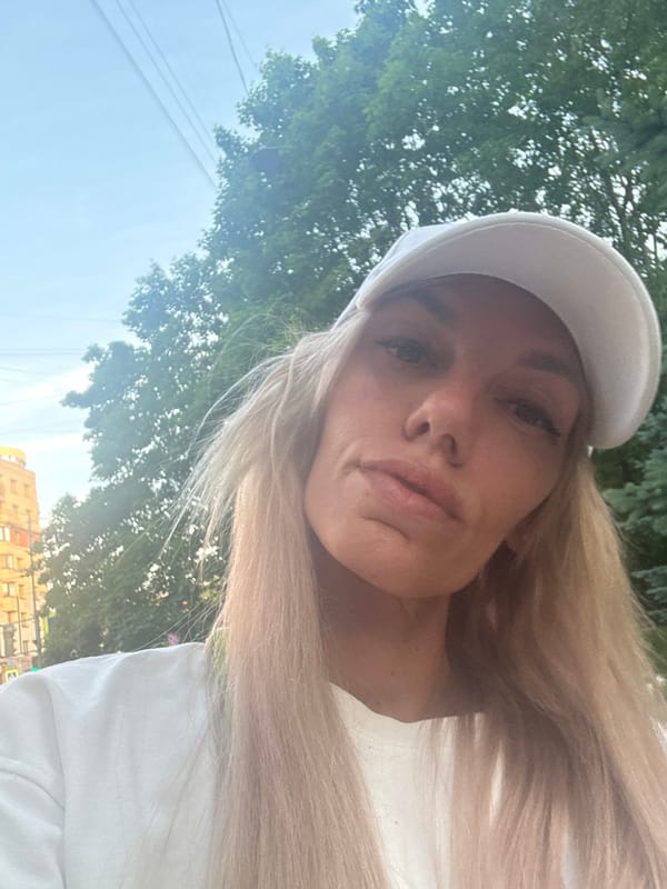 Woman photographs sunset stroll with French Bulldog in Saint Petersburg
