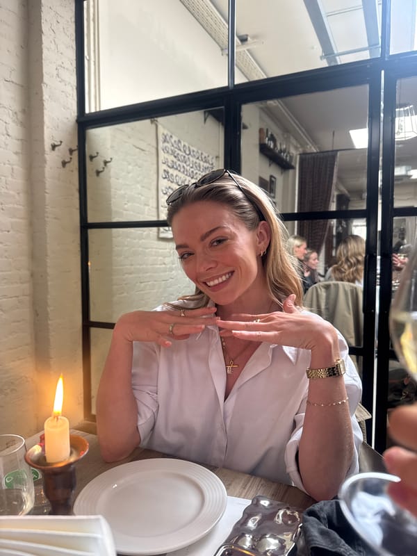 Woman dining at restaurant with wine, modern interior observed