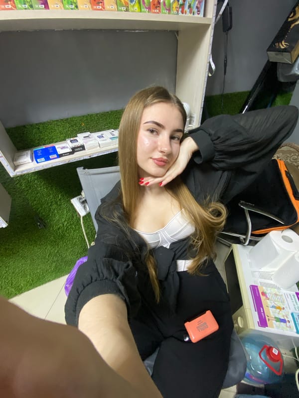 Young woman photographed posing indoors in Dyakovo, Russia