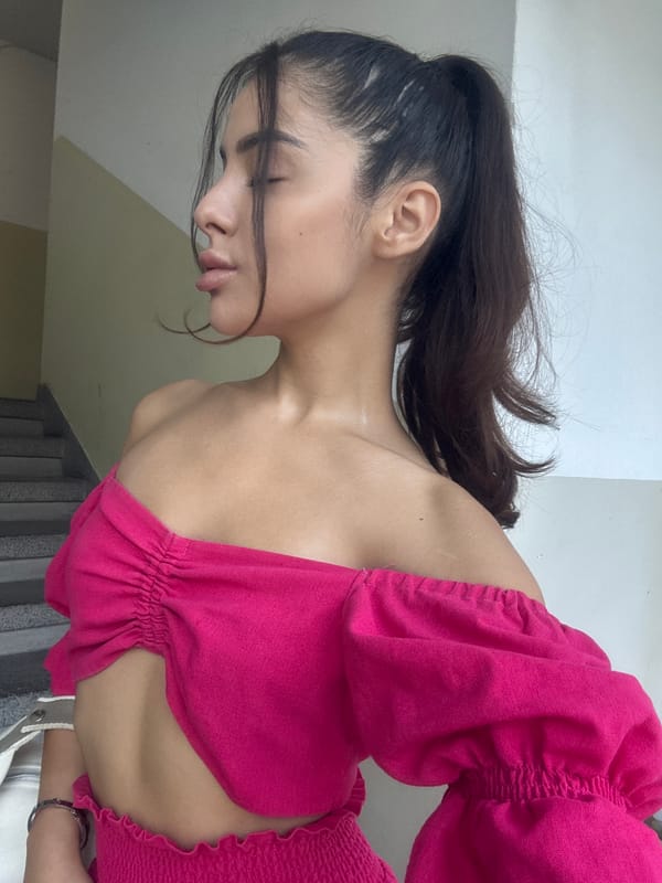 Close-up portrait in a ruffled pink top, Plovdiv