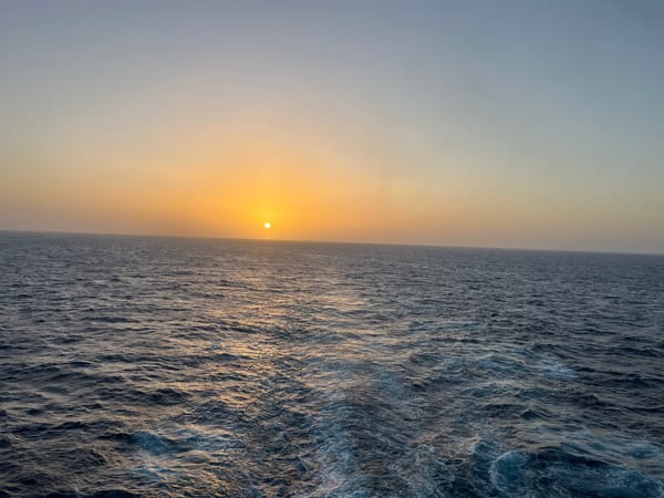 Ocean sunset observed at evening hour, golden light captured