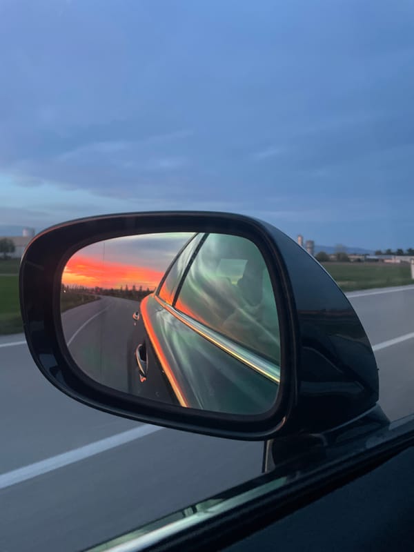 Sunset reflection captured in car mirror in San Lorenzo