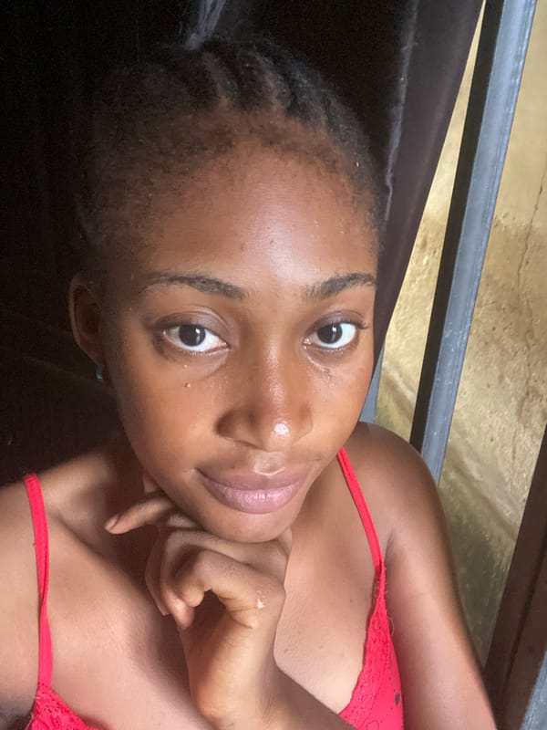 Selfie session in Kubwa, red camisole, multiple angles