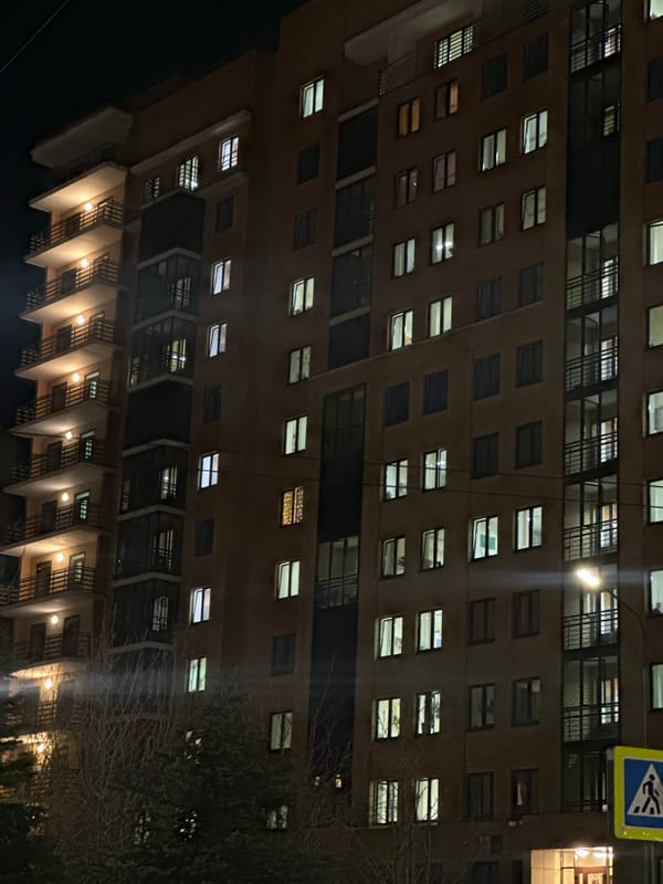 Illuminated apartment building photographed at night in Kazan