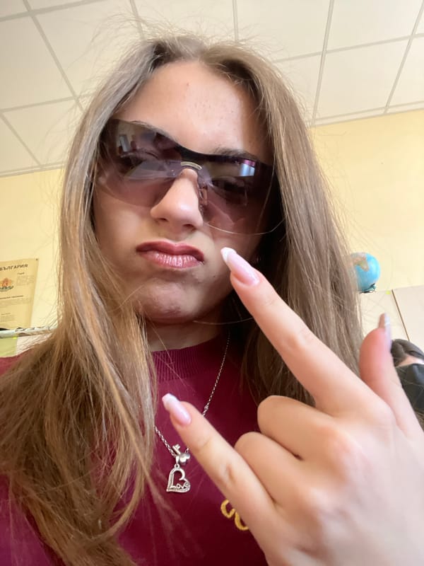 Young women take playful selfies in Plovdiv classroom setting