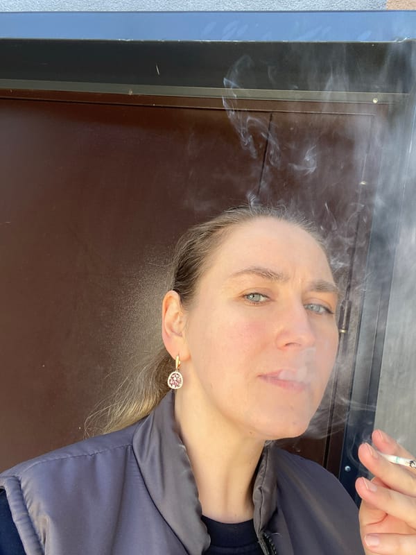 Woman smoking outside early morning in Yekaterinburg