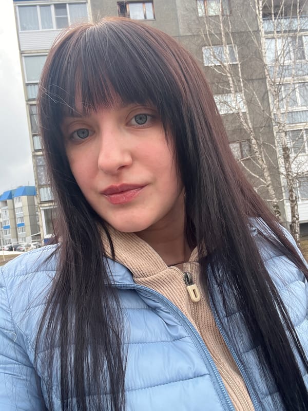Woman takes selfies in different outfits in Марковский, Russia