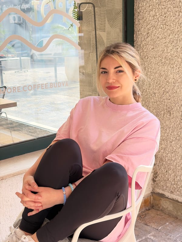 Young woman works morning shift at Budva coffee shop
