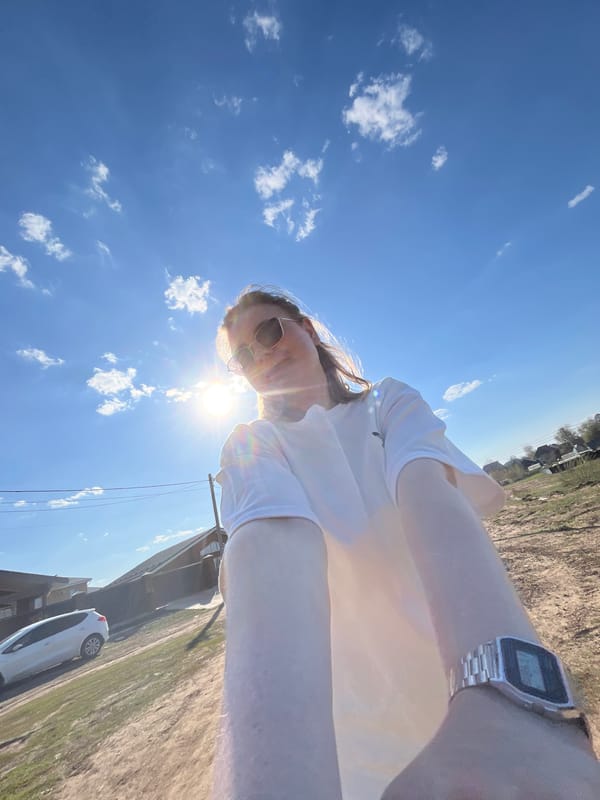Woman photographed with infant during rural outing in Chaikovsky
