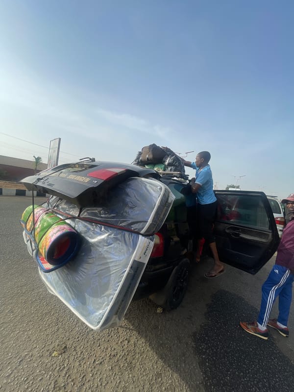 Overloaded car with belongings spotted near Jos monument